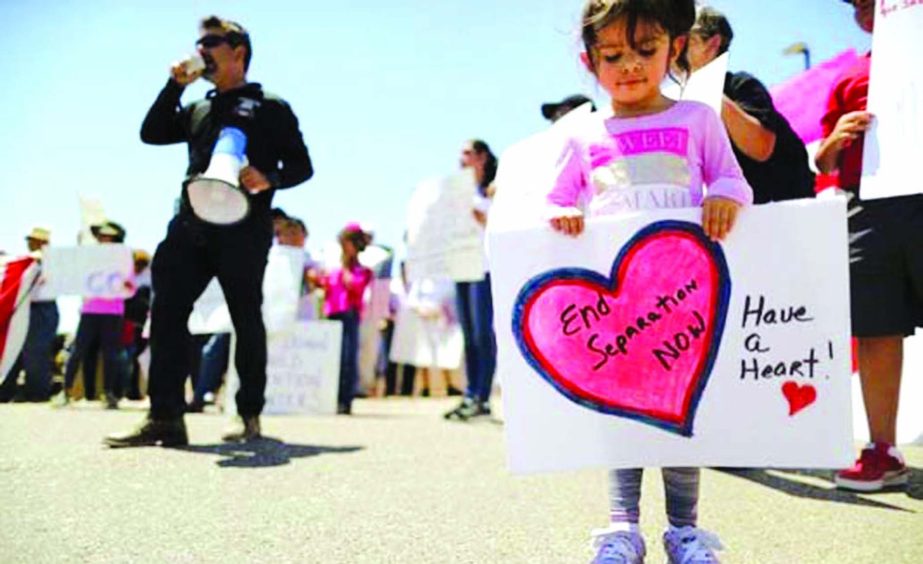 People take part in a protest for migrant rights in Clint, Texas.