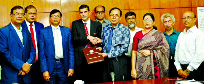 Adil Raihan, Deputy Managing Director of Mercantile Bank Ltd and Dipika Bhattacharjee, General Manager of Investment Corporation of Bangladesh (ICB), exchanging an agreement signing document at ICB Head Office in the city recently to provide loan facility