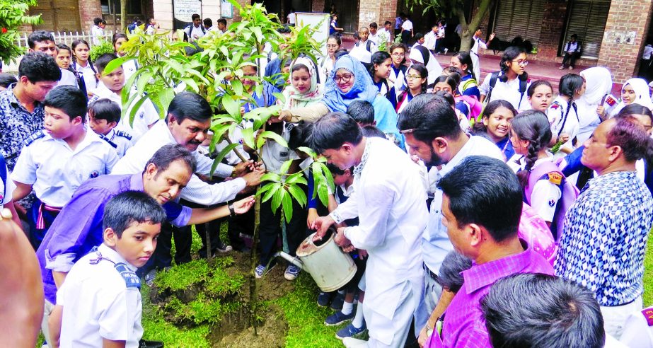 Chairman of the Governing Body of the city's Willes Little Flower School and College Arifur Rahman Titu along with the teachers and students of the institution inaugurating the tree plantation campaign on its premises on Wednesday.