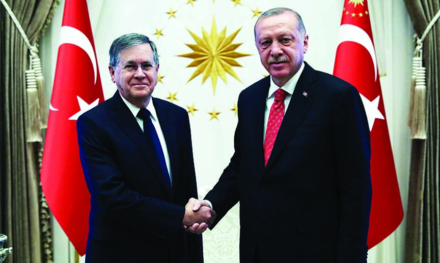 Erdogan shaking hands with US Ambassador David Michael Satterfield in Ankara.