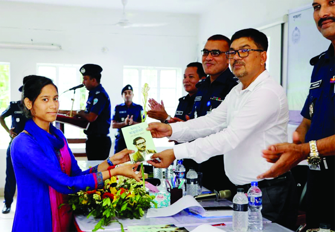 NOAKHALI: Tonmoy Das, DC and Md Alamgir Hossain, SP, Noakhali distributing book titled "Bangabandhu's Unfinished Biography" among the newly- recruited policemen in district at Shaheed Constable Moinul Haque Hall recently.
