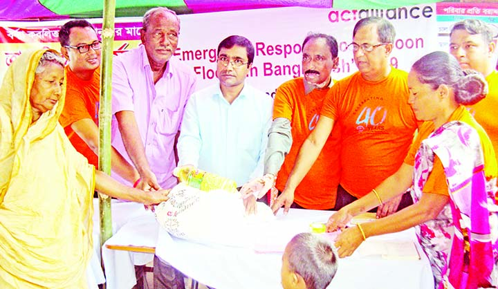 SAGHATA (Gaibandha): Uzzal Kumar Ghosh, UNO inaugurating relief distribution programme among the flood affected people at Saghata Upazila organised by Ramchandrapur Palli Unnoyan Kendro as Chief Guest on Sunday.