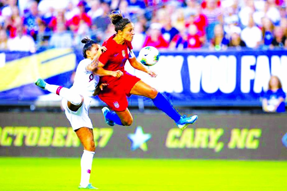 American Carli Lloyd competes for the ball with Portugal's Ana Borges in the first half of the United States' 4-0 friendly win at Lincoln Financial Field on Thursday.
