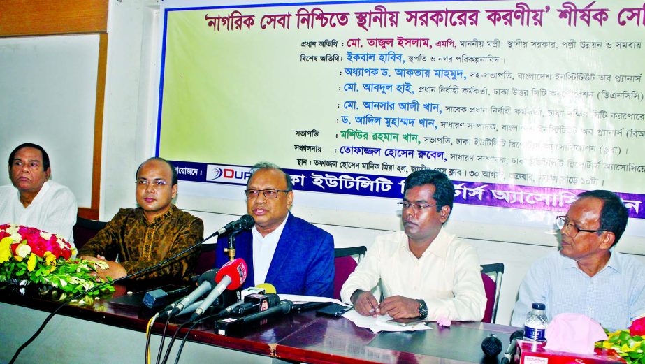 Local Government Minister Tajul Islam speaking at a seminar on 'Role of Local Government in Ensuring Civic Amenities' organised by Dhaka Utility Reporters Association at the Jatiya Press Club on Friday.