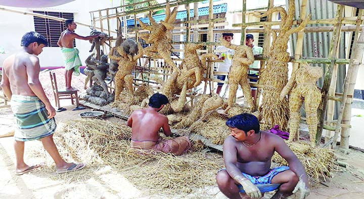 MIRZAPUR (Tangail): Idols makers passing busy time ahead of Durga Puja at Palpara in Mirzapur Sadar Upazila. This picture was taken yesterday.