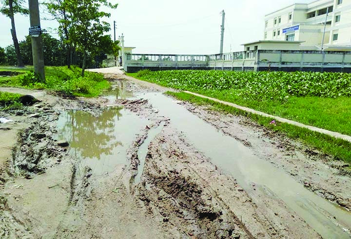 NAOGAON: The dilapidated road in front of Naogaon Technical Training Centre(TTC) needs immediate repair. This snap was taken yesterday. Photo: Hafizur Rahman