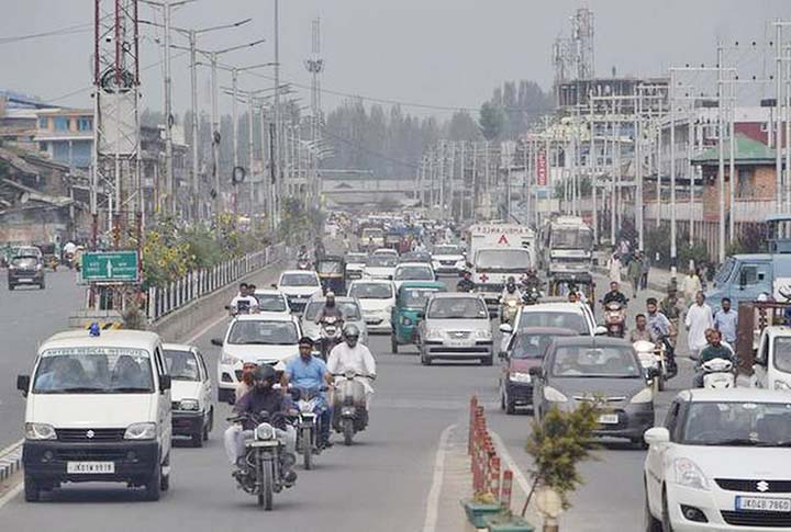 Vehicles ply after ease in restriction in Srinagar on Saturday
