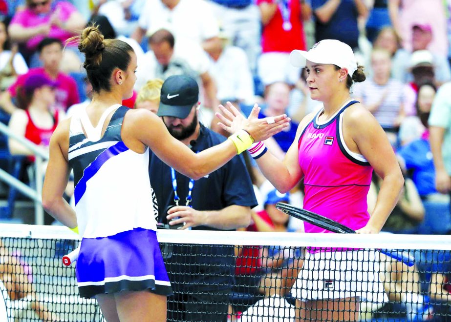 Ashleigh Barty (right) of Australia, shakes hands with Maria Sakkari of Greece, after winning their third round match of the US Open tennis championships in New York on Friday.