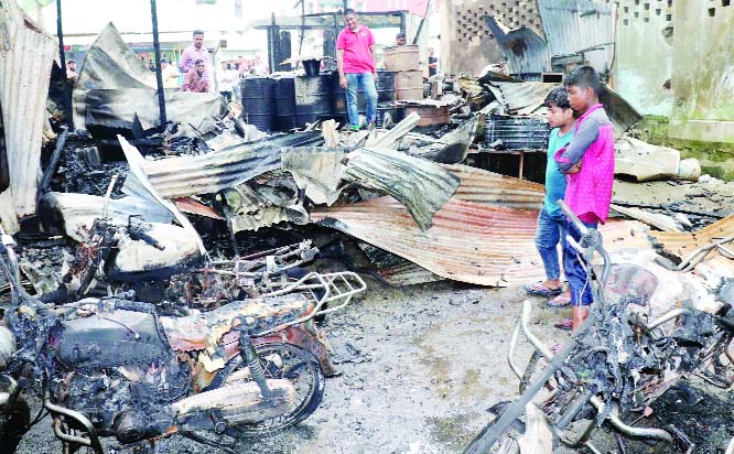 MURADNAGAR (Cumilla): A devastating fire gutted two business houses with six motorbikes in Muradnagar Sadar Upazila on Friday.