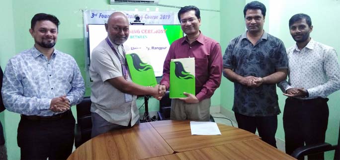 Vice-Chancellor of Begum Rokeya University, Rangpur Prof Dr Major Nazmul Ahsan Kalimullah, BNCCO and Policy Adviser of a2i Anir Chowdhury shake hands after signing a MoU on behalf of their respective institutions in a formal ceremony held at the conferenc