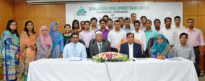 Mohammad Mejbahuddin, Chairman of Bangladesh Development Bank Ltd, poses for a photograph along with participants after inaugurating a 24-days "Foundation training course for officer (general and cash)" of the bank at its training institute in the city