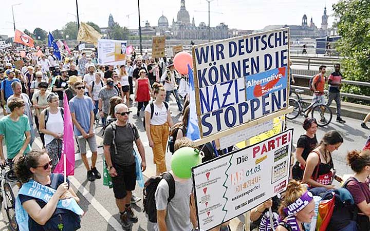 Protesters take part in a demonstration titled "Unteilbar" (indivisible) against exclusion in Dresden, eastern Germany.