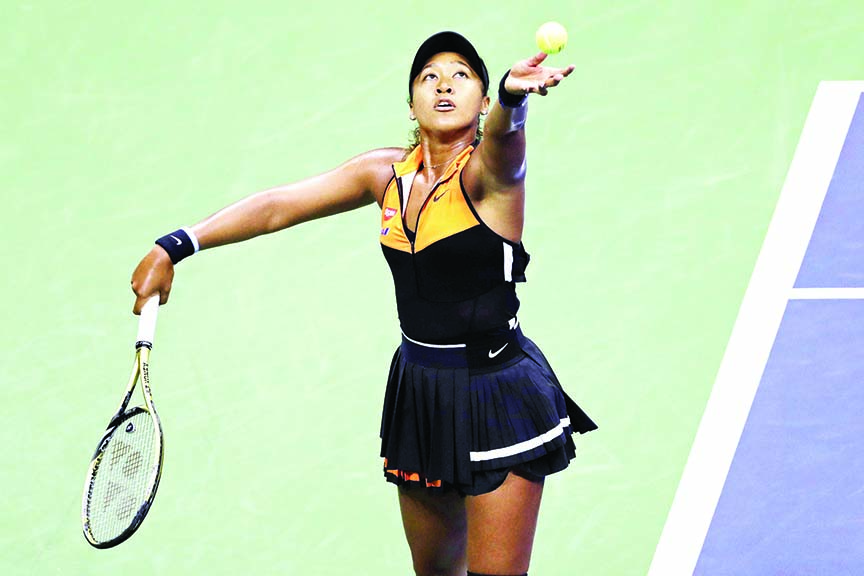 Naomi Osaka of Japan, serves to Coco Gauff of United States, during the third round of the U.S. Open tennis tournament in New York on Saturday.