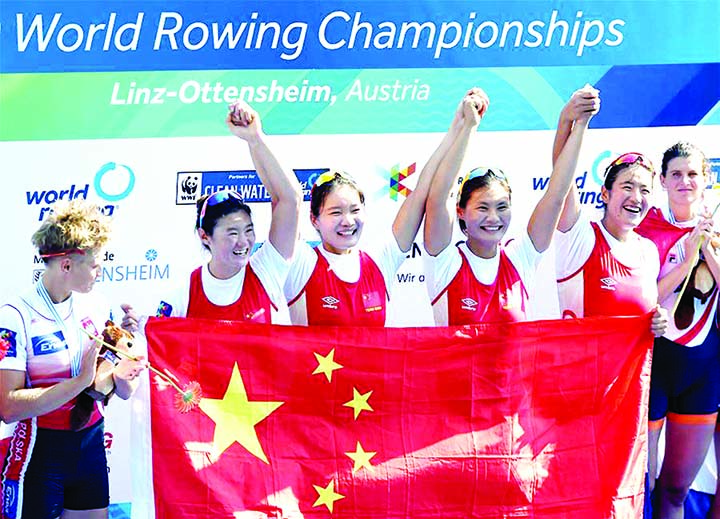 China's Chen Yunxia, Zhang Ling, Lyu Yang and Cui Xiaotong (2nd left- 2nd right) celebrate during the award ceremony of the women's quadruple sculls final at the 2019 World Rowing Championships in Linz Ottensheim, Austria on Saturday.