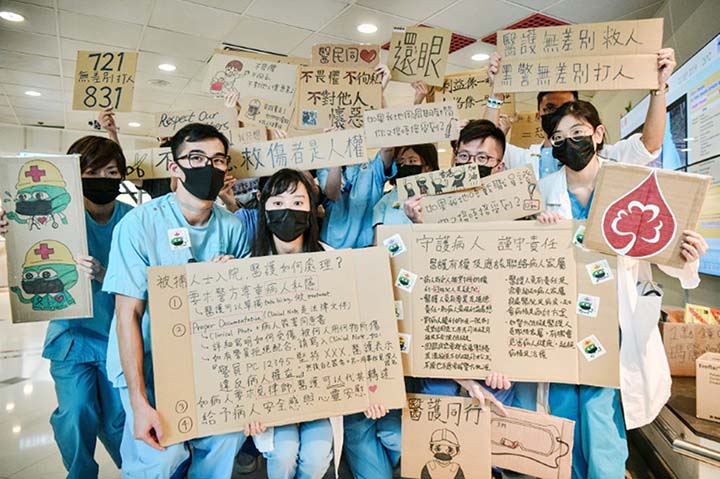 Medical staff holding placards in support of anti-government protesters lined the corridors of several Hong Kong hospitals.