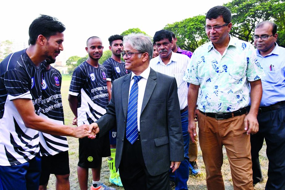 Vice-Chancellor of Dhaka University (DU) Professor Dr. Md. Akhtaruzzaman being introduced with the participants of Inter-Department Football Competition of DU as the chief guest at the Central Playground of DU on Monday.