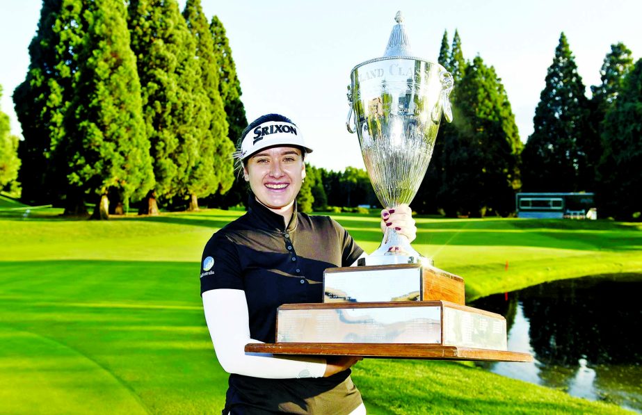 Hannah Green of Australia, poses with the trophy after winning the LPGA Cambia Portland Classic golf tournament in Portland, Ore on Sunday.