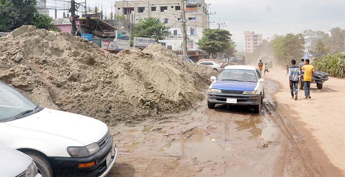 Construction materials on Port-connecting Road at Noyabazar hampering vehicles movement. This snap was taken yesterday.