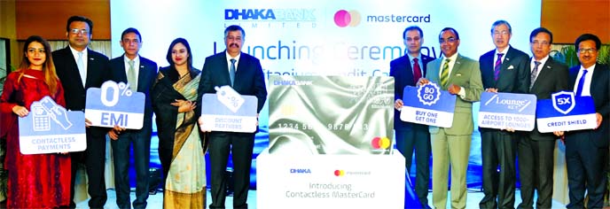 Syed Mahbubur Rahman, Managing Director of Dhaka Bank Ltd, pose for a photograph along with Syed Mohammad Kamal, Country Manager of Mastercard, after launching Mastercard Titanium Contactless Credit Card at a city hotel on Monday. Emranul Huq, Additional
