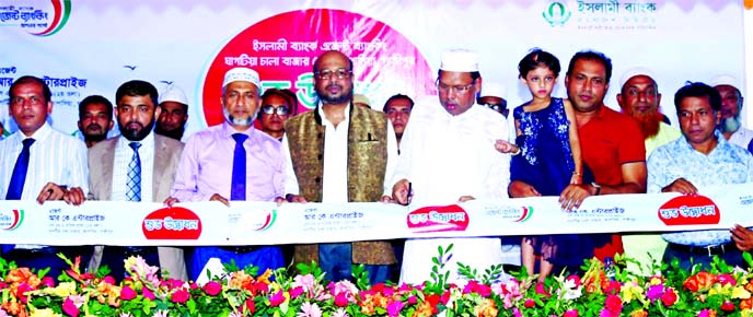 Abu Reza Md Yeahia, Deputy Managing Director of Islami Bank Bangladesh Ltd and Advocate Md Amanat Hossain Khan, Chairman of Kapasia Upazila Parisad, inaugurating the bank's Agent Banking Outlet at Ghagotia Chala Bazar under Kapasia Upazila of Gazipur rec