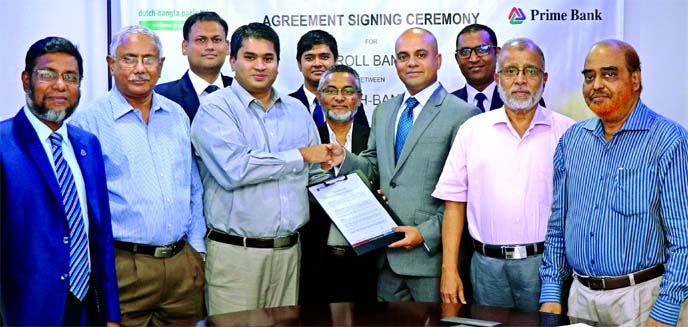 Mamur Ahmed, Head of Consumer Sales & Collection of Prime Bank Limited and Abdul Mumit, Managing Director of Dutch-Bangla Pack Limited (DBPL), exchanging an agreement signing document at the banks head office in the city recently. Under the deal, employee