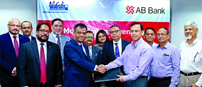 Abdur Rahman, DMD of AB Bank Limited and Captain (Retd) Mohammed Salimullah, Managing Partner of Meet, Greet & Assist (MGA) services, exchanging an agreement signing document at the bank's head office in the city recently. Under the deal, AB bank credit