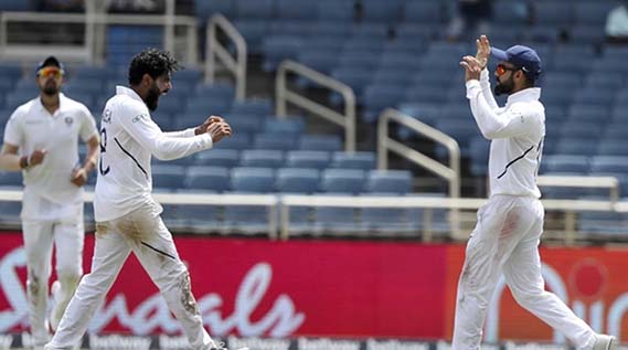 Virat Kohli(right) celebrating with Ravindra Jadeja after the last wicket of West Indies at Sabina Park in Kingston, Jamaica on Monday.