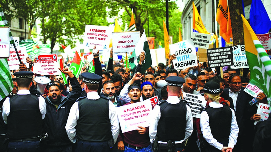 Demonstrators protest the scrapping of the special constitutional status in Kashmir, outside the Indian High Commission in London.