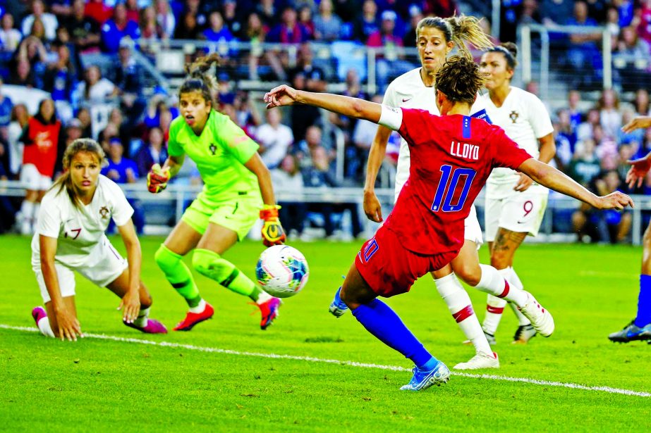 United States' Carli Lloyd scores a goal against Portugal during the first half of a friendly soccer match in St. Paul, Minn on Tuesday.