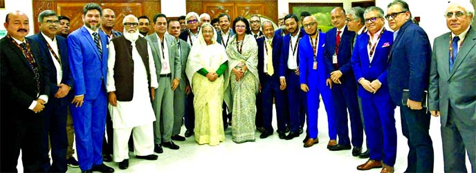 Prime Minister Sheikh Hasina poses for photograph with the members of the Board of Directors led by Dr. Rubana Huq, President of Bangladesh Garment Manufacturers and Exporters Association (BGMEA), after a courtesy call at Ghonobhaban on Wednesday.