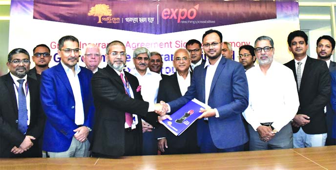 MM Monirul Alam, CEO of Guardian Life Insurance Limited (GLIL) and M H Khusru, CEO of Expo Group, exchanging an agreement signing document at GLIL head office in the city on Wednesday. Under the deal, employees of the Expo Group and their family members w