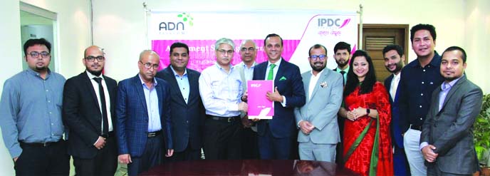 Mominul Islam, CEO of IPDC Finance Limited and Asif Mahmood, Chairman of ADN Group, exchanging an agreement signing document at IPDC head office in the city on Thursday. Under the deal, IPDC will offer financial solutions and counselling to the employees