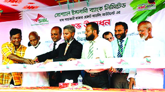 Md. Mashiur Rahman In charge of Agent Banking Division of Social Islami Bank Limited, inaugurating its Agent Banking Outlet at Nagorpur in Tangail recently. Senior officials of the bank and local elites were also present.