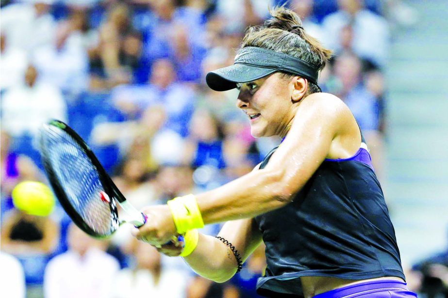 Bianca Andreescu of Canada, returns a shot to Elise Mertens of Belgium, during the quarterfinals of the U.S. Open tennis tournament in New York on Wednesday.