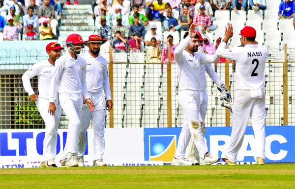 Players of Afghanistan, celebrating after dismissal of Liton Das (not in the picture) during the second day of the first Test between Bangladesh and Afghanistan at the Zahur Ahmed Chowdhury Stadium in Chattogram on Friday.