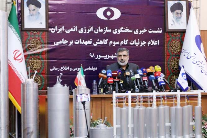 Atomic Energy Organization spokesman, Behrouz Kamalvandi, details Iran's latest nuclear moves at a Tehran press conference, assisted by mock-ups of the different uranium enrichment centrifuges at its disposal.