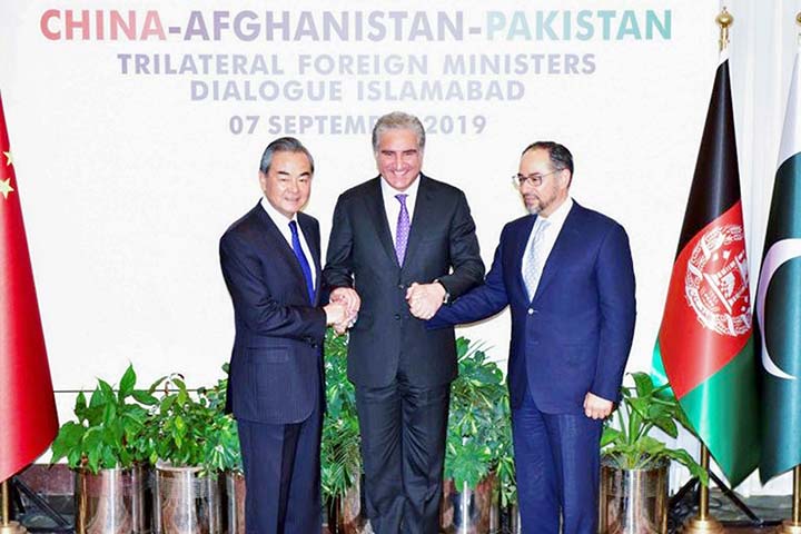 Pakistan's Foreign Minister Shah Mehmood Qureshi Â©, Chinese Foreign Minister Wang Yi (L) and Afghan Foreign Minister Salahuddin Rabbani Â® expressed hope that direct talks between the Kabul government and Taliban begin soon .