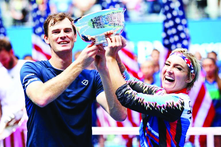 Britain's Jamie Murray (left) and American Bethanie Mattek-Sands hold the champions trophy after winning their second consecutive US Open mixed doubles title on Saturday.