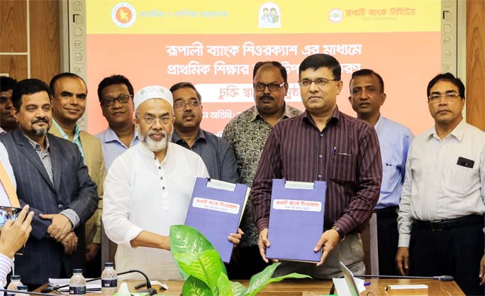Md. Badiar Rahman, Director, Directorate of Primary Education and Mohammad Jahangir Alam, Deputy Managing Director, Rupali Bank Ltd showing the documents signed on behalf of their respective organizations in the city recently while State Minister Md. Zaki