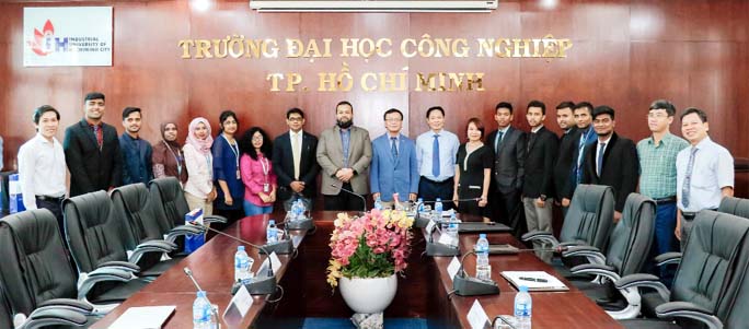 Full Scholarship winning 11 students of Daffodil International University along with Dr Nguyen Thien Tue, Rector of Industrial University of Ho Chi Minh City, Vietnam pose for a photo shoot with Mohamed Emran Hossain, Director (Administration), DIU and Dr