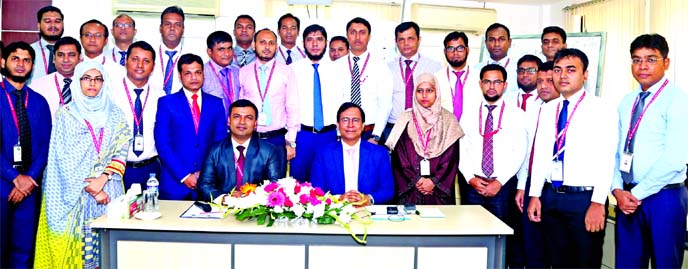 TariqulAzam, AMD of Standard Bank Limited, poses for photo session with the participants of a day-long training on "MCSME Portfolio Management & Reporting" at the bank's Training Institute in the city on Sunday. Md Amzad Hossain Fakir, Faculty of the i
