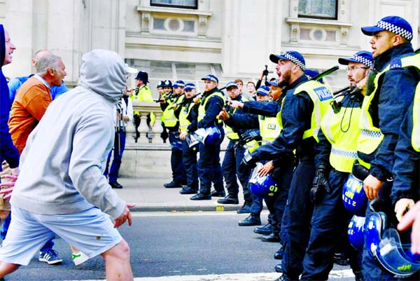 Demonstrators faced police in London during an anti-govt protest calling for Prime Minister Boris Johnson to resign.