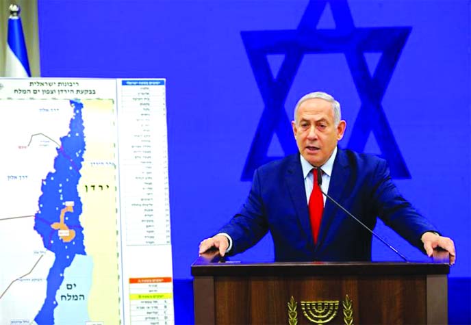 Israeli Prime Minister Benjamin Netanyahu, speaks during a press conference in Tel Aviv, Israel on Tuesday. Netanyahu vowed Tuesday to begin annexing West Bank settlements if he wins national elections next week.