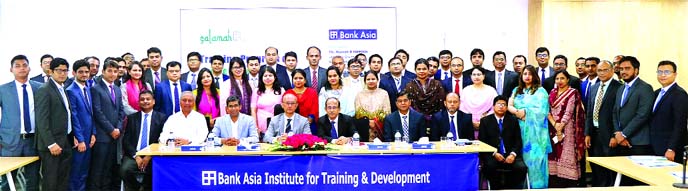 Rumee A Hossain, EC Chairman of Bank Asia Limited, poses for photograph with the participants of a day-long training course on "Islamic Banking & Finance" for 51 officials from different levels of the bank at its Institute for Training & Development in