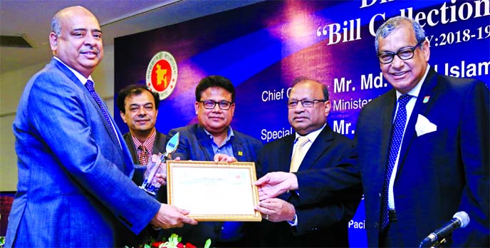 Syed Waseque Md Ali, Managing Director of First Security Islami Bank Limited, receiving certificate for achieving the 1st position in bill collection amongst 33 banks selected by Dhaka WASA in the financial year 2018-19 from LGRD Minister Md. Tazul Islam,