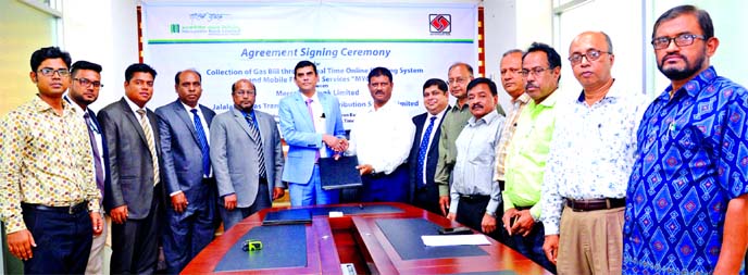 Adil Raihan, DMD of Mercantile Bank Limited and SM Asadul Haque, Company Secretary of Jalalabad Gas Transmission & Distribution System Limited (JGTDSL), exchanging an agreement signing document at JGTDSL's liaison office in the city recently. Under the d