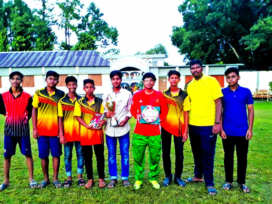 Members of Singair Government High School team, the champions in the Handball (Boys') Competition (upazila level) of the Bangladesh School & Madrasa Summer Sports Competition pose with the trophies at Singair Government High School Ground in Singair upaz
