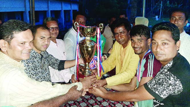 BARAIGRAM (Natore): Md Shariaj, DC, Natore distributing trophy of the final Bangabandhu Football Tournament at Tirail High School ground in Baraigram on Saturday