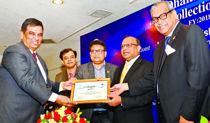 Md. Abdul Halim Chowdhury, CEO of Pubali Bank Limited, receiving the 'Bill Collection Award' as one of the top WASA bill collectors bank among 33 banks in fiscal year 2018-19 from LGRD & Cooperatives Minister Md. Tazul Islam, MP at Sonargaon Hotel in th