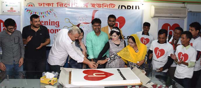 Mezbah Uddin Sarker Rubel, CEO of Heartsbook (an alternative Social Media flat form of Face book), inaugurating its commercial operation in Bangladesh through cutting a cake at Dhaka Reporter's Unity in the city on Sunday. Mahabuba Mohammad Babon Sarker,